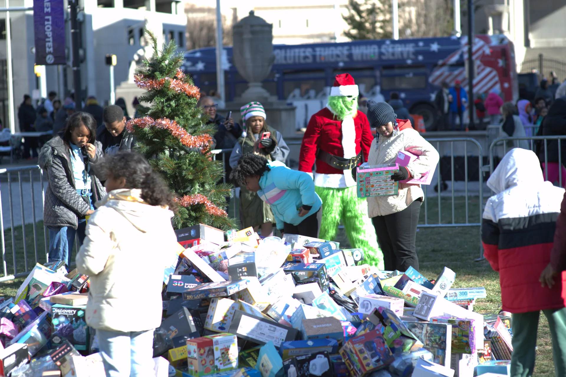 The Grinch helping kids find toys